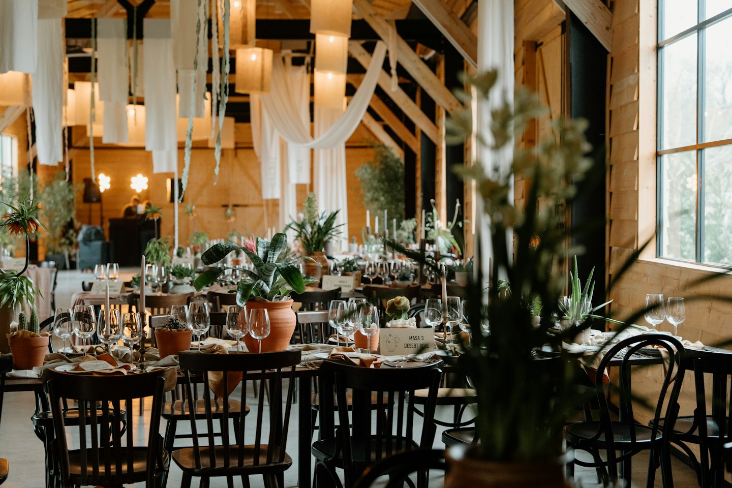 Elegant event space with long tables set for a celebration.